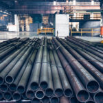 Close-up view of steel pipes in Iron and Steel Factory or Pipe Mill located in Taganrog South of Russia waiting for shipment in warehouse