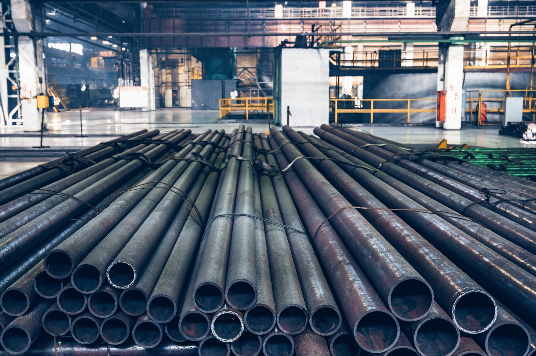 Close-up view of steel pipes in Iron and Steel Factory or Pipe Mill located in Taganrog South of Russia waiting for shipment in warehouse